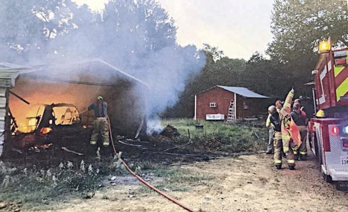 Carport, vehicle fire extinguished in west part of county